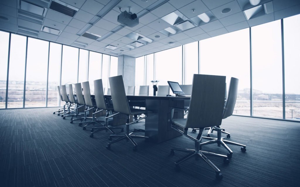 Page banner depicting an office conference room